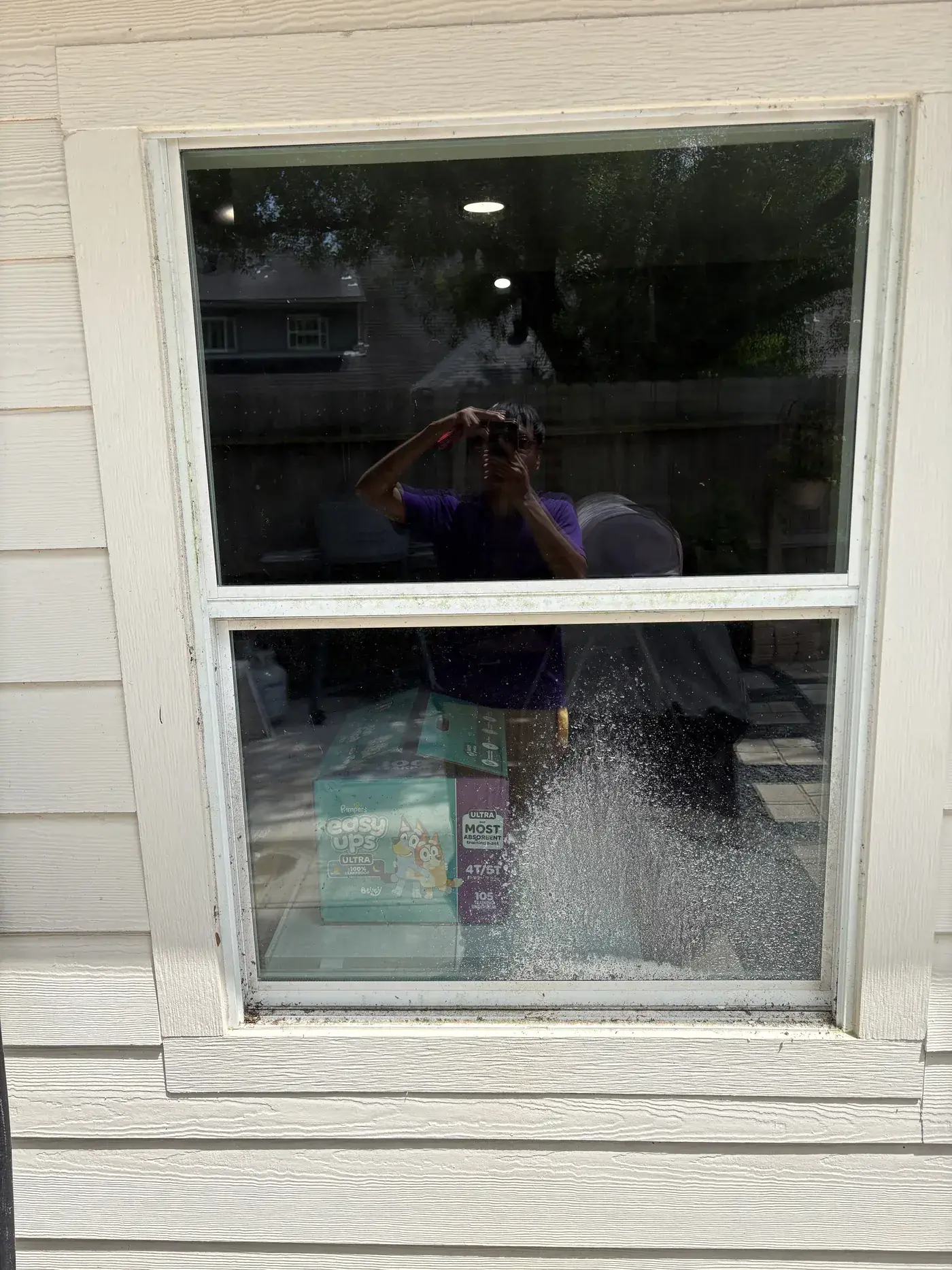 Before: hard-water spotting and grime across the glass