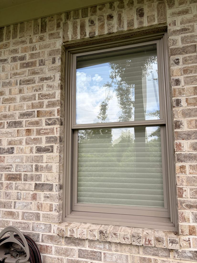 Window detail after Premium Restore — glass and frame like new