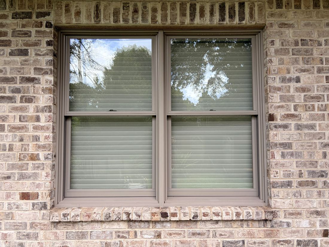 Two windows fully restored, frames and sills matching the clean glass