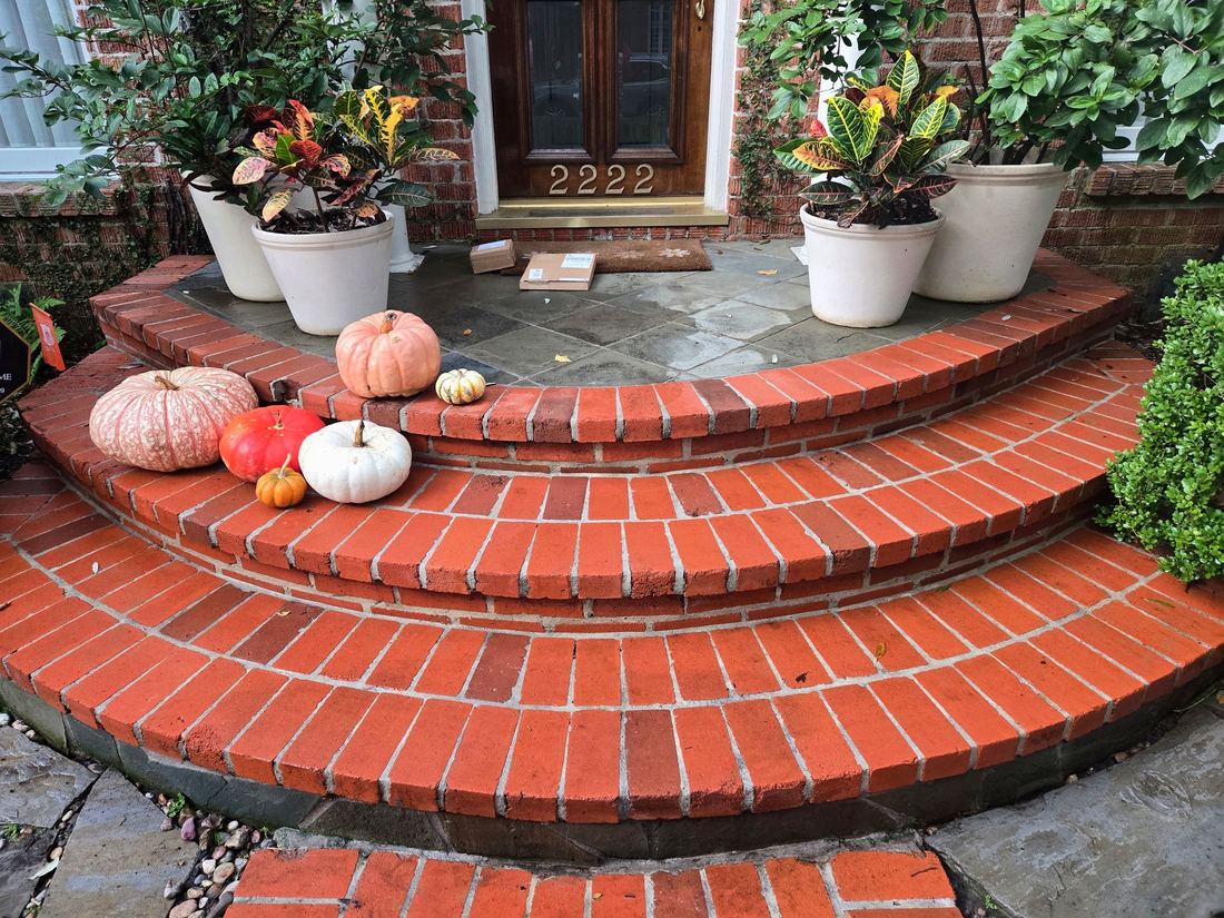 Brick front steps restored by pressure washing