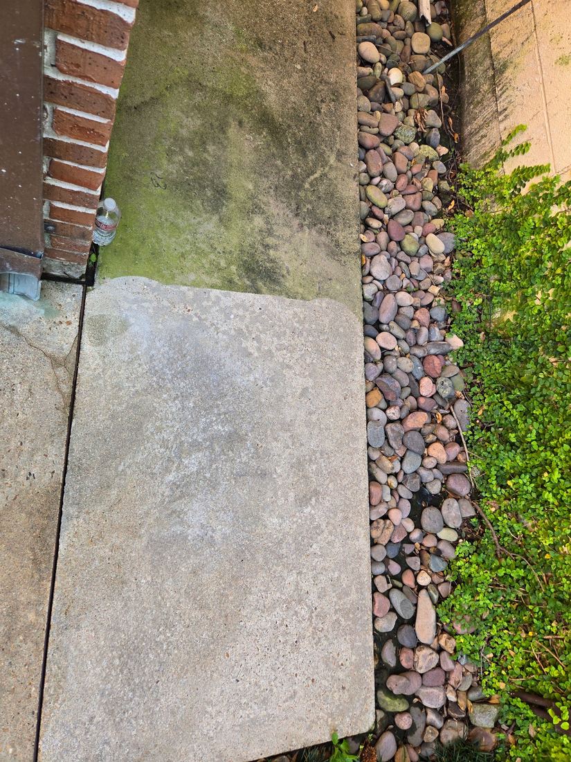 Stone slab half-cleaned showing the dramatic difference