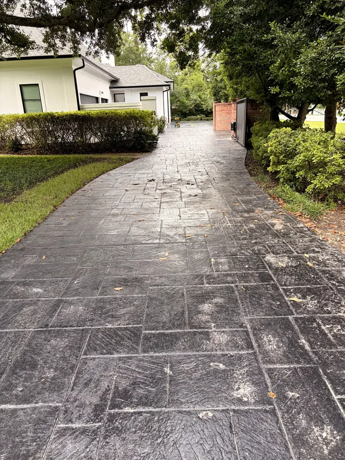Driveway before pressure washing