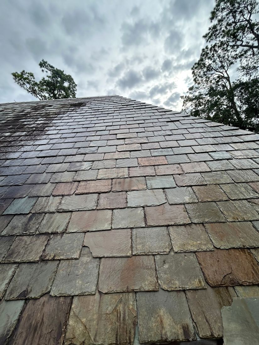 The same slate roof during our gentle soft wash treatment