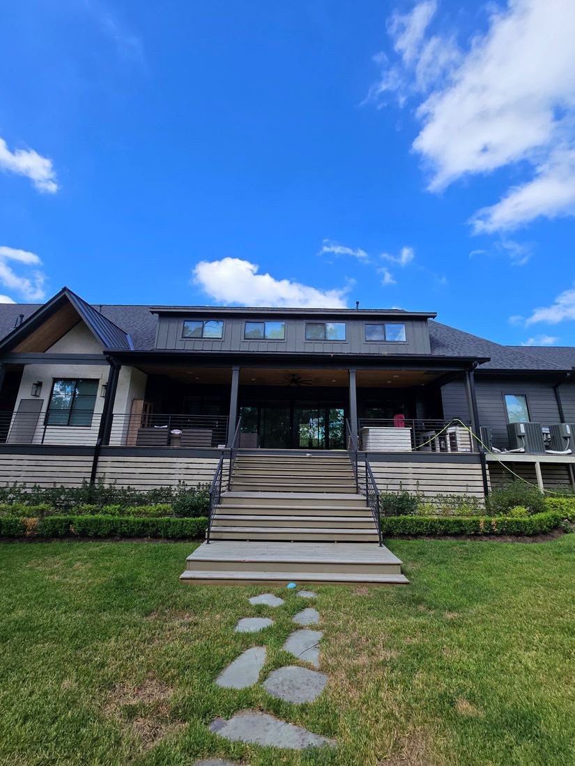 Modern farmhouse exterior spotless after a whole-home soft wash