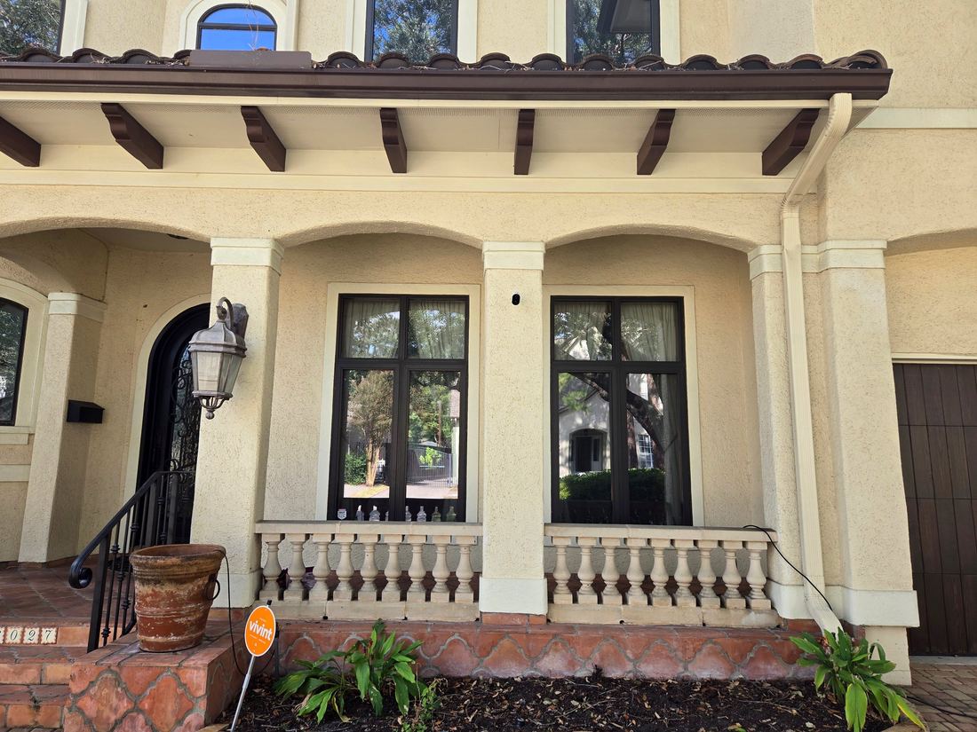 Spot-free windows gleaming on a Mediterranean-style Houston home